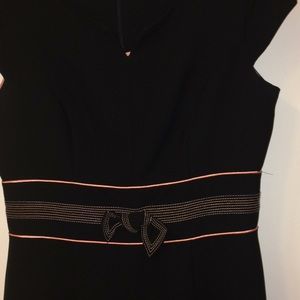 Black AGB knee length dress with v-neck.